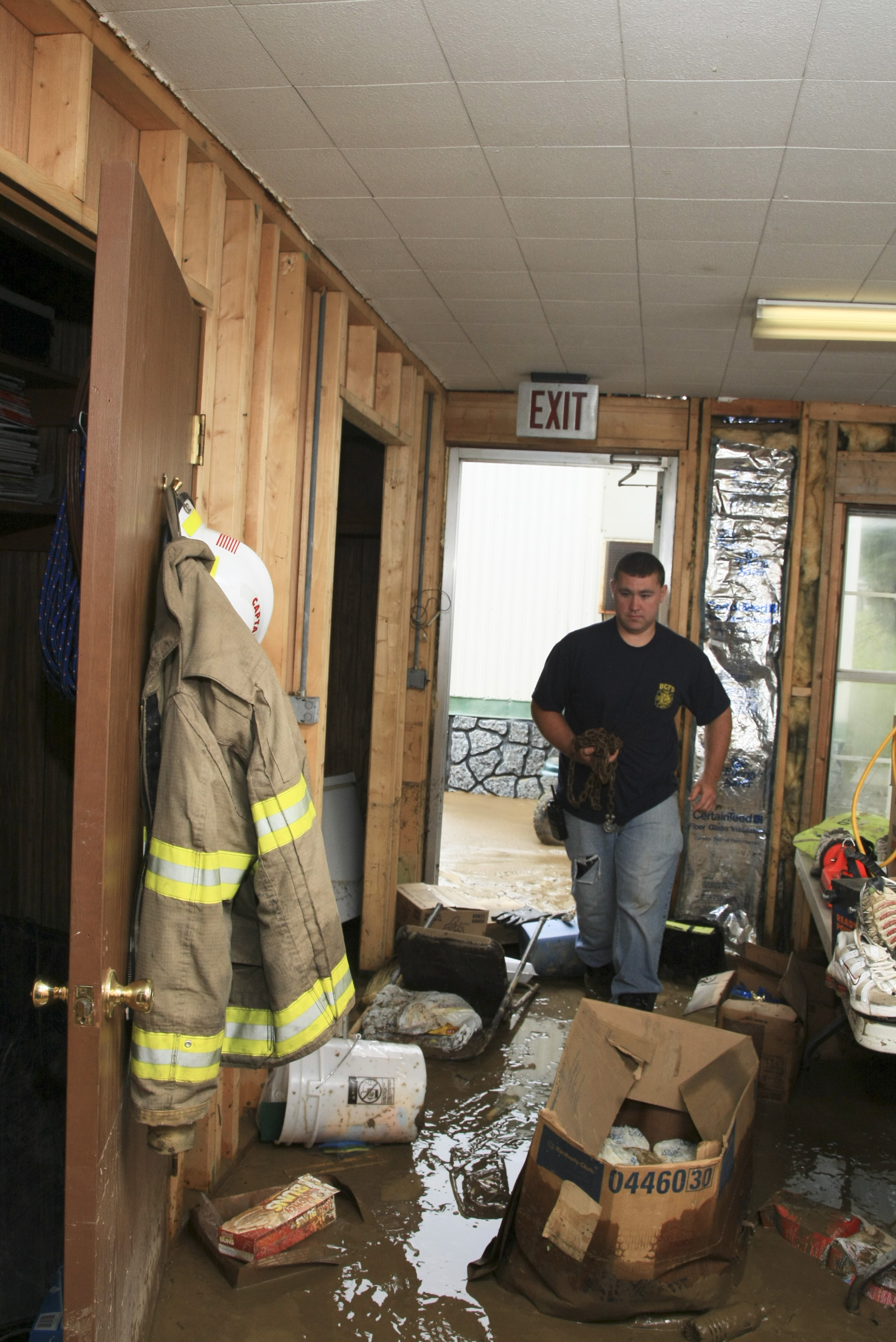 Representative FEMA cleanup scene showing the controlled interior work that follows emergency stabilization and damage documentation.